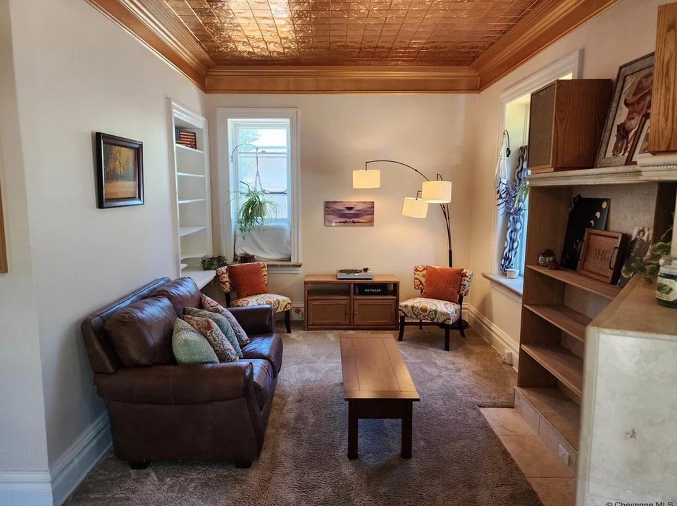 Living room with tin ceiling